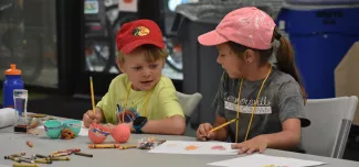 campers doing an arts and craft activity 